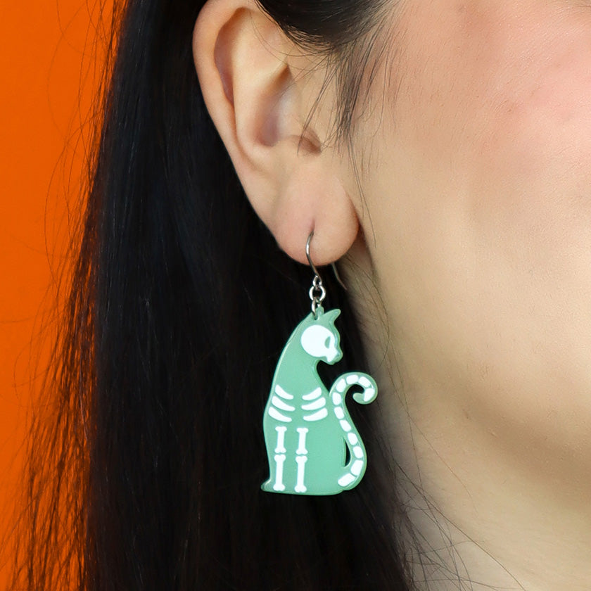 erstwilder bone kitty drop earrings halloween glow in the dark