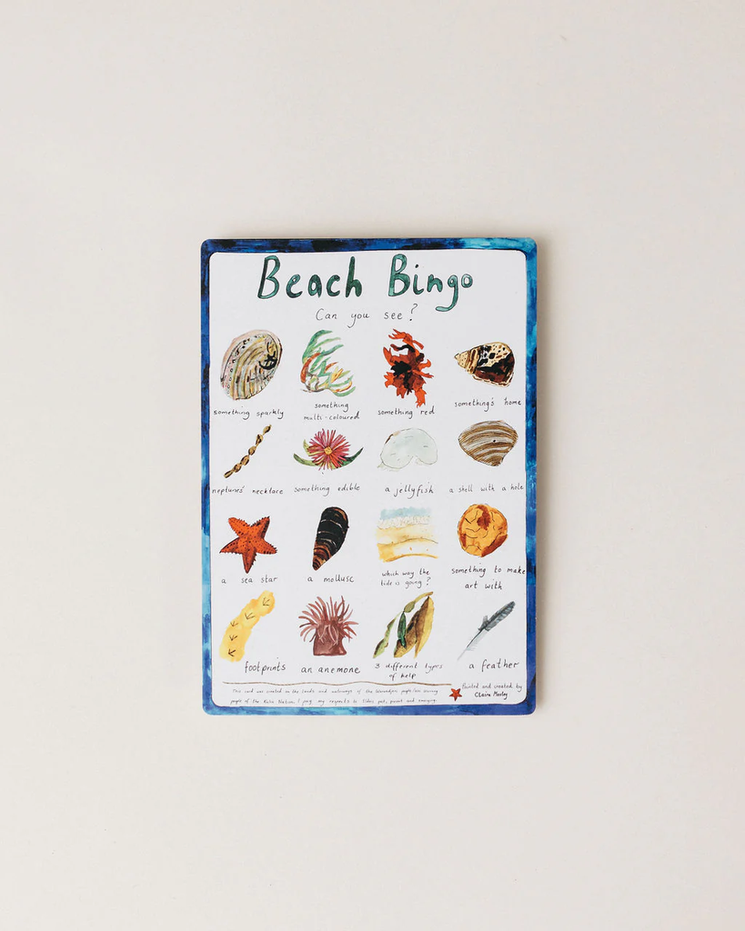 Beach Bingo game board with illustrations of beach items on a white background