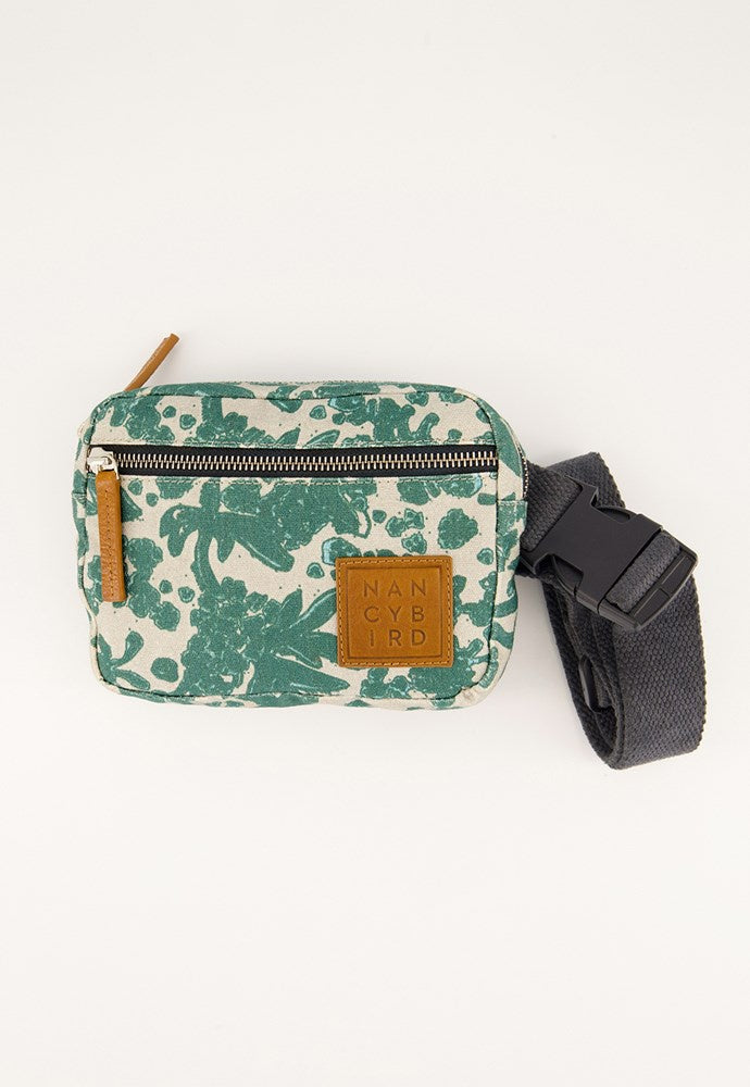 Green and white patterned waist bag with a brown strap on a white nancybird background  parsley belt bag