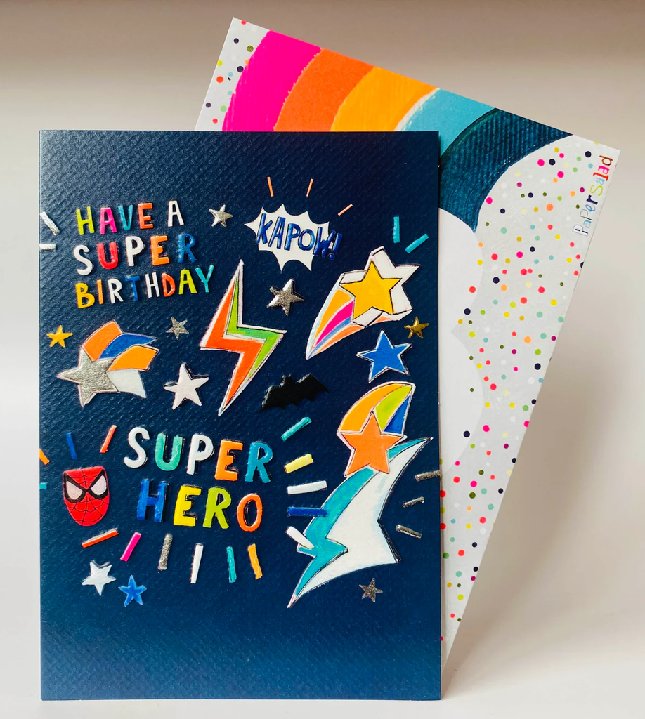Colorful birthday card with superhero design on a neutral background